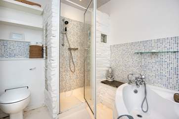 The bathroom on the ground floor has a lovely bath and seperate shower.