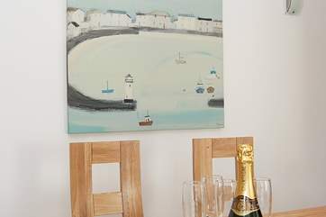 Modern artwork mixes with vintage pieces around the house.