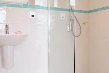 Bedroom 1 has an en suite shower-room with a walk-in shower.