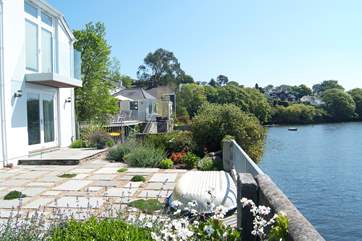 The sitting-room and Bedroom 1 below face out over the water.