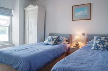 Bedroom 2 has 'zip and link' beds and wonderful views over the creek.
