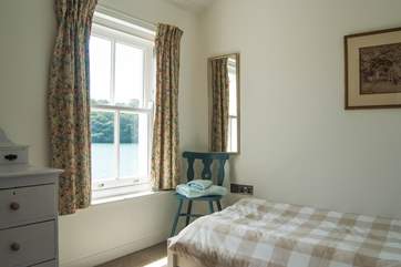 Bedroom 3 has a single bed and creek views.