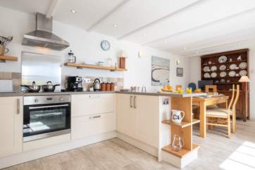 The open-plan kitchen/dining-room is a light sociable space to spend time with friends and family.