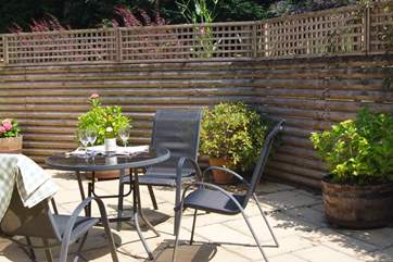 The patio is sheltered, totally private and can be enclosed if you bring a dog with you.