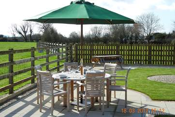 There is a beautiful place to sit and eat outside, overlooking the fields.