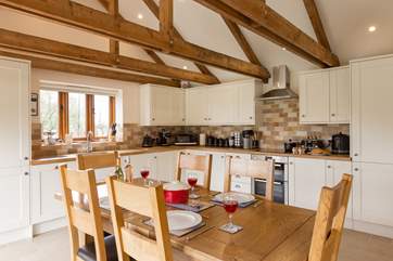 The kitchen is fitted around two walls at the far end of the ground floor. It is superbly equipped for you.