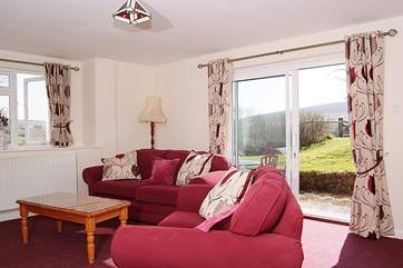 The sunny sitting-area, with French windows out to the patio and garden - and those breathtaking views.