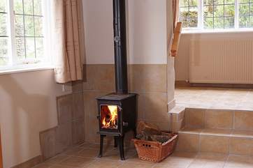 There is a lovely little wood-burner downstairs - please shut the door when in use (the steps are to the dining-area and front door).