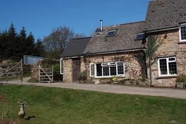 There is a large farmyard in front of the cottage, complete with duck pond.