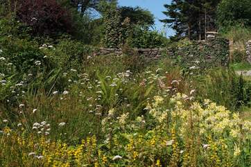 The cottage looks out at this pretty garden area to the front.
