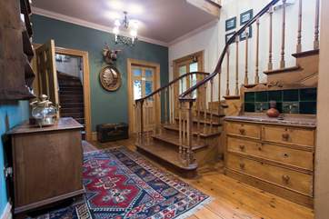 The first floor hallway which leads up to the second floor.