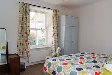 Light and airy ground floor Bedroom 1 has a king-size bed and wonderful sea views.