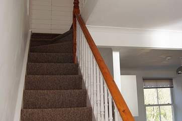 The original cottage staircase turns and divides at the top two steps (please take care).