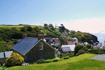 Set on the hillside overlooking the cove, Coth Lytherva has a large garden which includes plenty of parking space at the side.