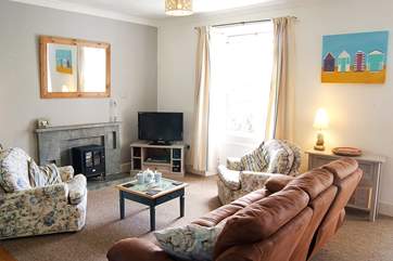 A comfy sofa and seating for everyone.