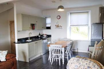 Beyond the living-room are the downstairs bedroom and bathroom, and the utility-room.