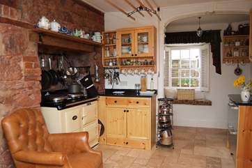 Looking through the kitchen to the small entance hall and front door.