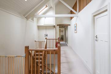 The hall from the top of the stairs into the sitting-room leads to the four bedrooms and family bathroom.