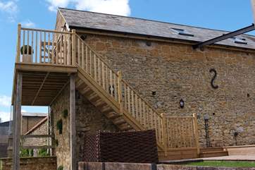 External wooden steps lead up to Lottie's Loft.