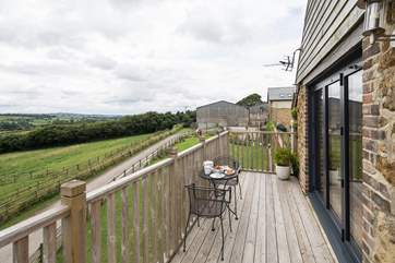 There is plenty of room on the balcony for a table and chairs, so that you can relax and take in the views.