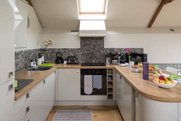 The kitchen-area is stylish and contemporary.