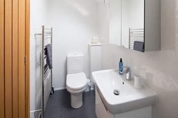 The shower room has a heated rail for snuggly warm towels.