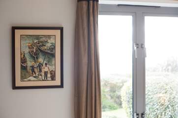 Bedroom 1 looks out over the gardens to the sea.