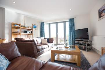 The light-fillied living-room.