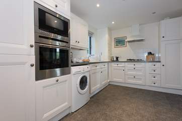 The kitchen has all necessary appliances.