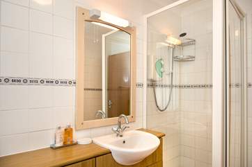 The bathroom also has a separate shower cubicle
