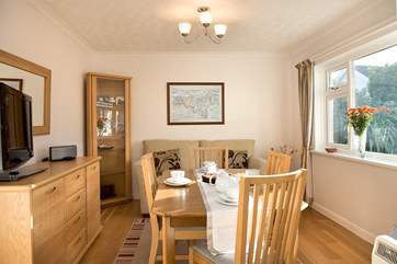 The dining room has a separate TV and sofa for anyone that wants some quiet time