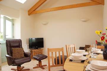 The first floor open plan living-room with kitchen and dining areas.