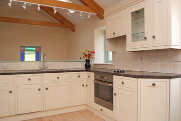 The kitchen area of the open plan living-room.