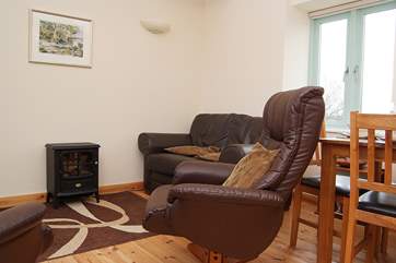 The first floor open plan living-room with kitchen and dining areas.