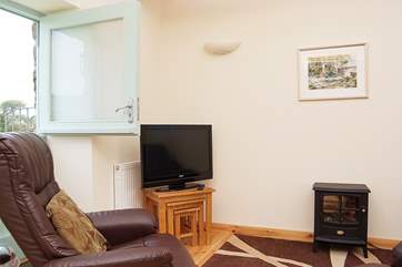 The sitting-area has an electric stove and a stable-door.