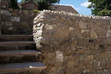 Wide paved steps lead up to the lawn (please take care).