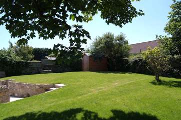 The raised lawn provides plenty of space for children to play (please take care with toddlers on the steps).