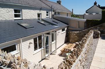 The 'sunken' patio is a very private, sunny spot to enjoy breakfast, lunch or supper outside.
