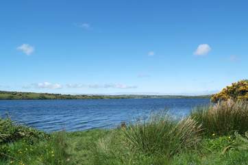 Looking across the reservoir from the southern side, towards the Watersports Centre and The Golden Lion pub on the northern shore.