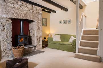 The snug which has stairs to the first floor, has a warming wood-burner in the old stone inglenook which is perfect for those cooler evenings.