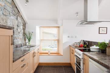 The kitchen is well designed, modernised in harmony with the character of the cottage.