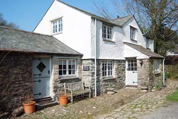 The outside of this pretty cottage, the original cobbles can still be seen.