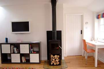 The wood-burner in the sitting-area.