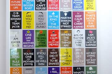 There are some bright modern posters throughout the cottage.