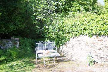 The cottage has its own sitting-area in a sunny corner of the courtyard.