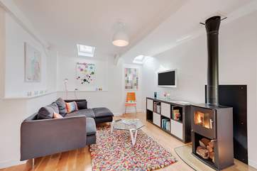 The living-room with its warming wood-burner.