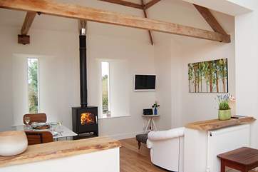 The sitting/dining side of the open plan living-room in this lovely single-storey cottage.