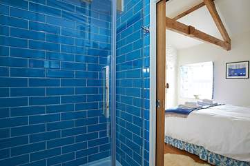 The en suite shower-room looking through to the bedroom.
