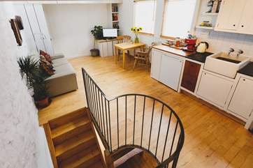 Looking down from the second floor to the first floor living-area.