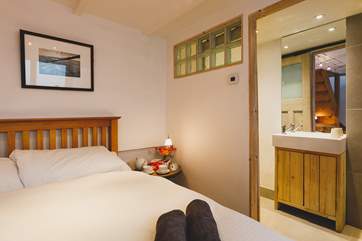 The bed is set close to the en suite wet-room.